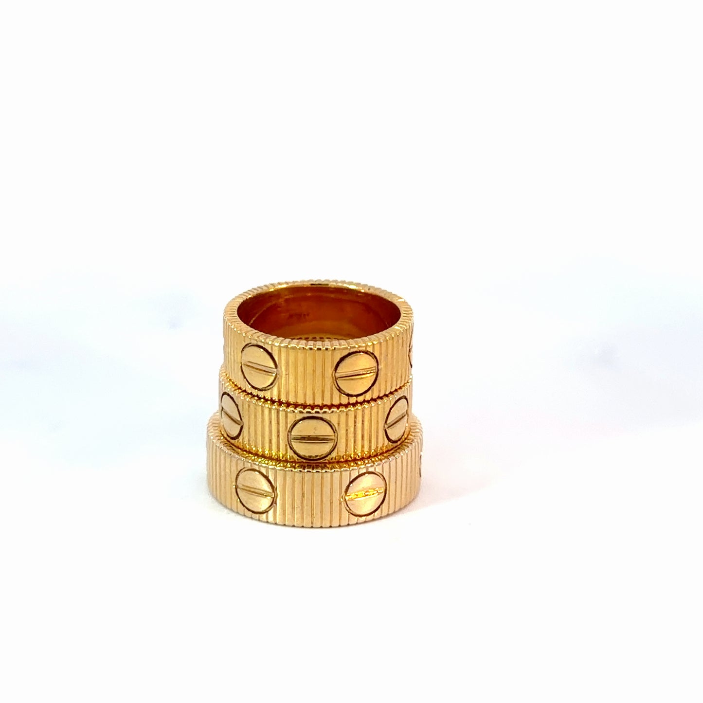Yellow Gold Ribbed Stackable Rings with Screw Motifs