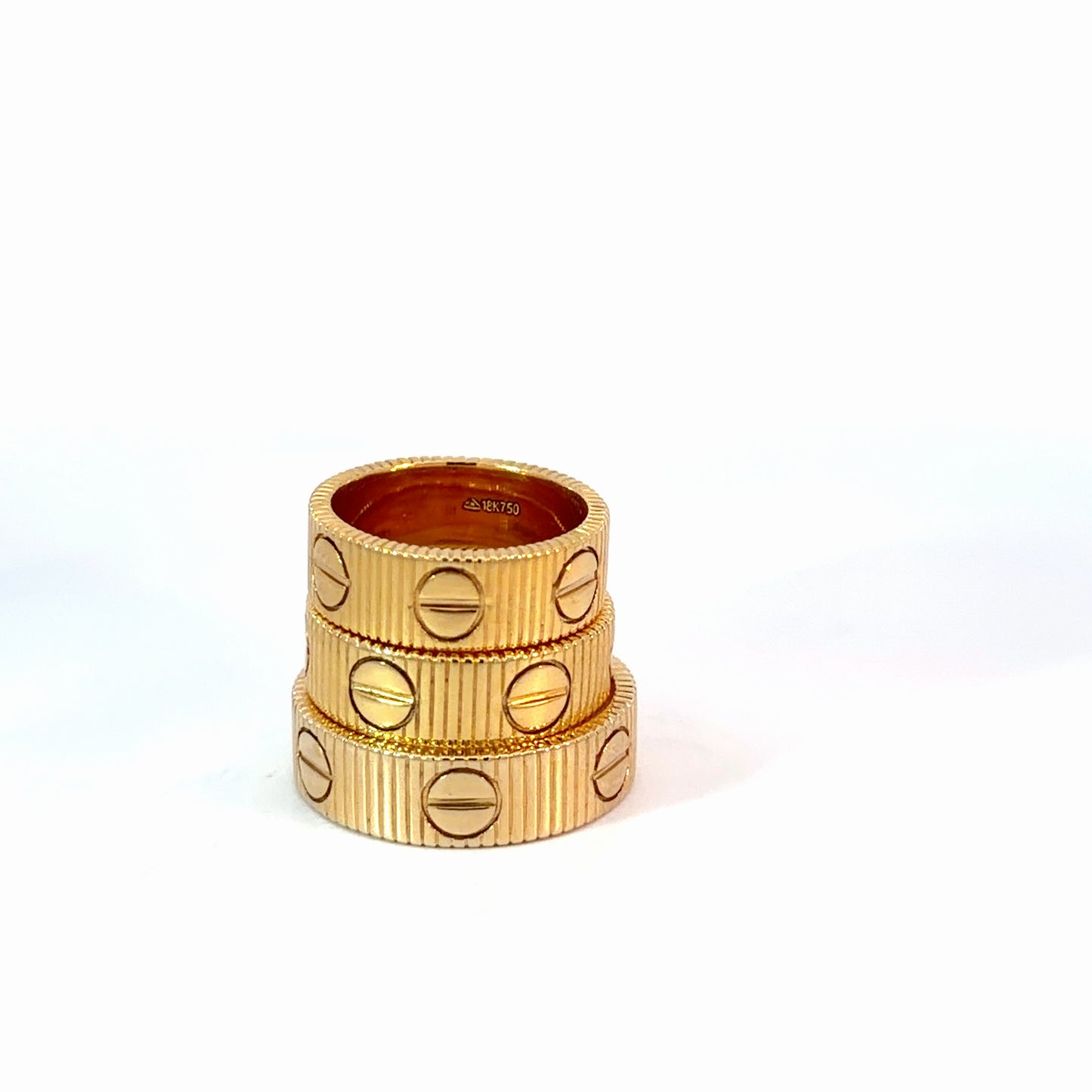 Yellow Gold Ribbed Stackable Rings with Screw Motifs