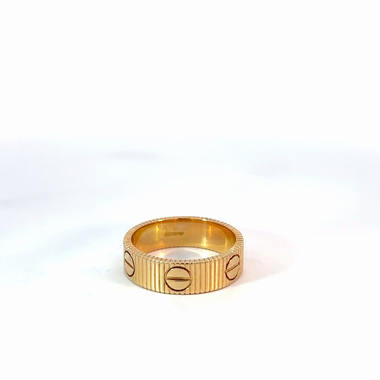Yellow Gold Ribbed Stackable Rings with Screw Motifs